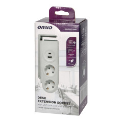 Skrivbordsströmskena av typen Schuko med USB-laddare och fjäderklämma för montering.