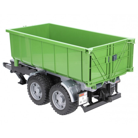 Släpvagn med container för gröna traktorer.