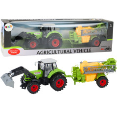 Jordbruks traktor med grön grävare och spruta.