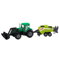 Traktor med lastare och grönmålning.