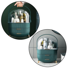 Organizator för kosmetika med öppningsbar transparent lock och två gröna lådor.