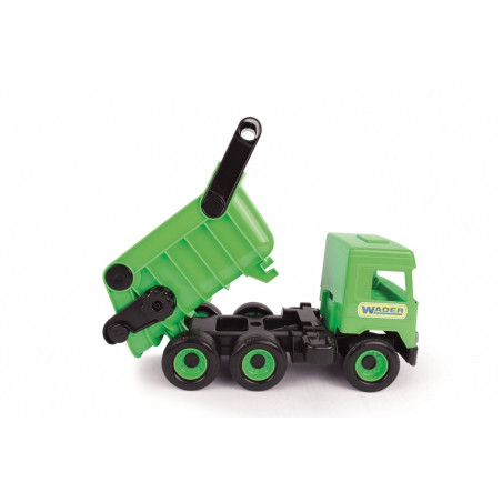 Grön dumpbil i mitten av lastbilen i en kartong