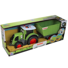 Lyckliga människor med en Claas-traktor med släpvagn. | HandlaSmidigt.se
